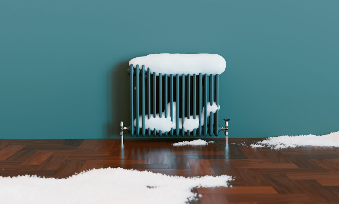 blue space heater covered in snow